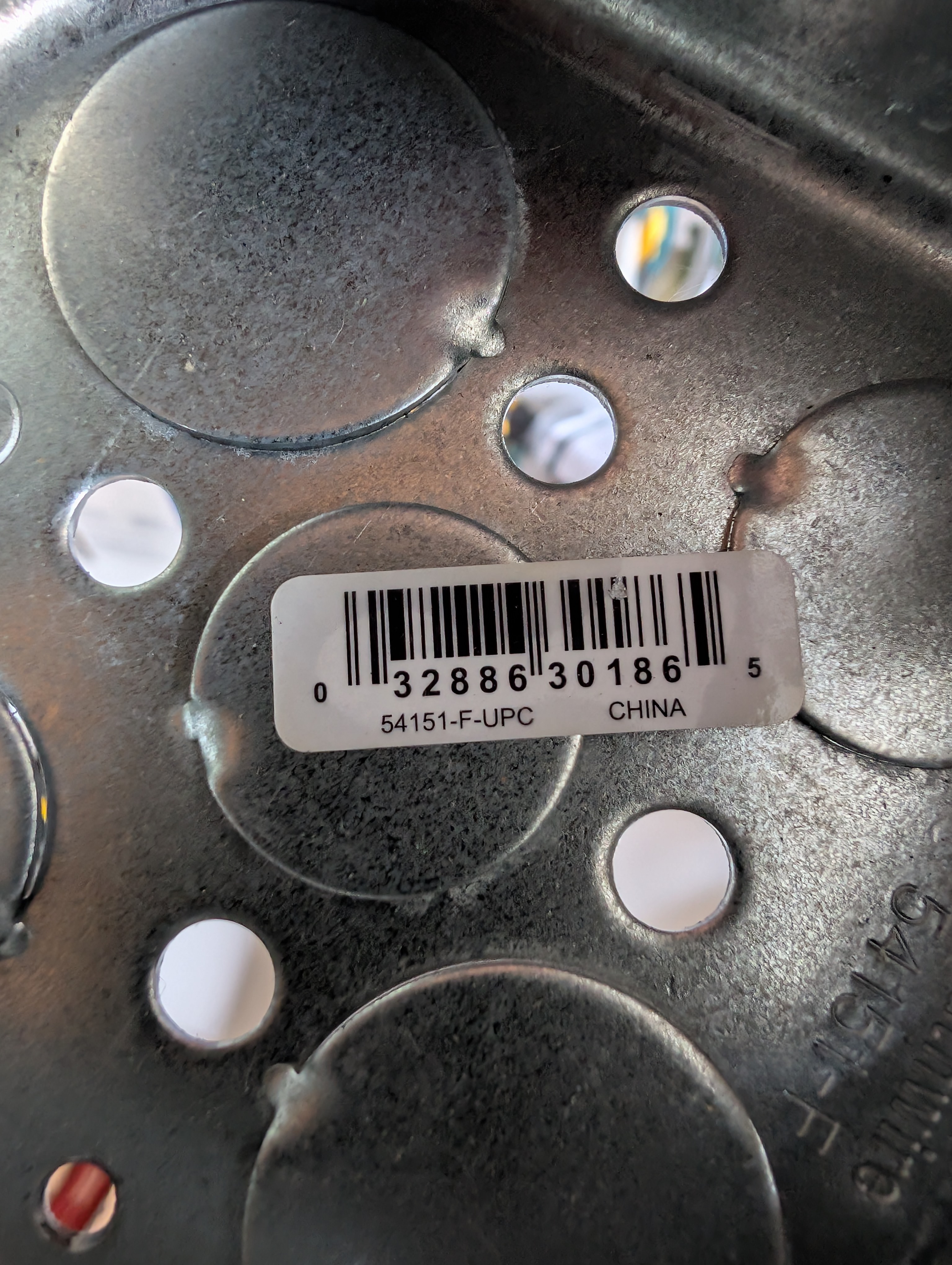 Closeup of the box interior stamp and 54151-F-UPC barcode label confirming the Southwire 4 inch octagon part number
