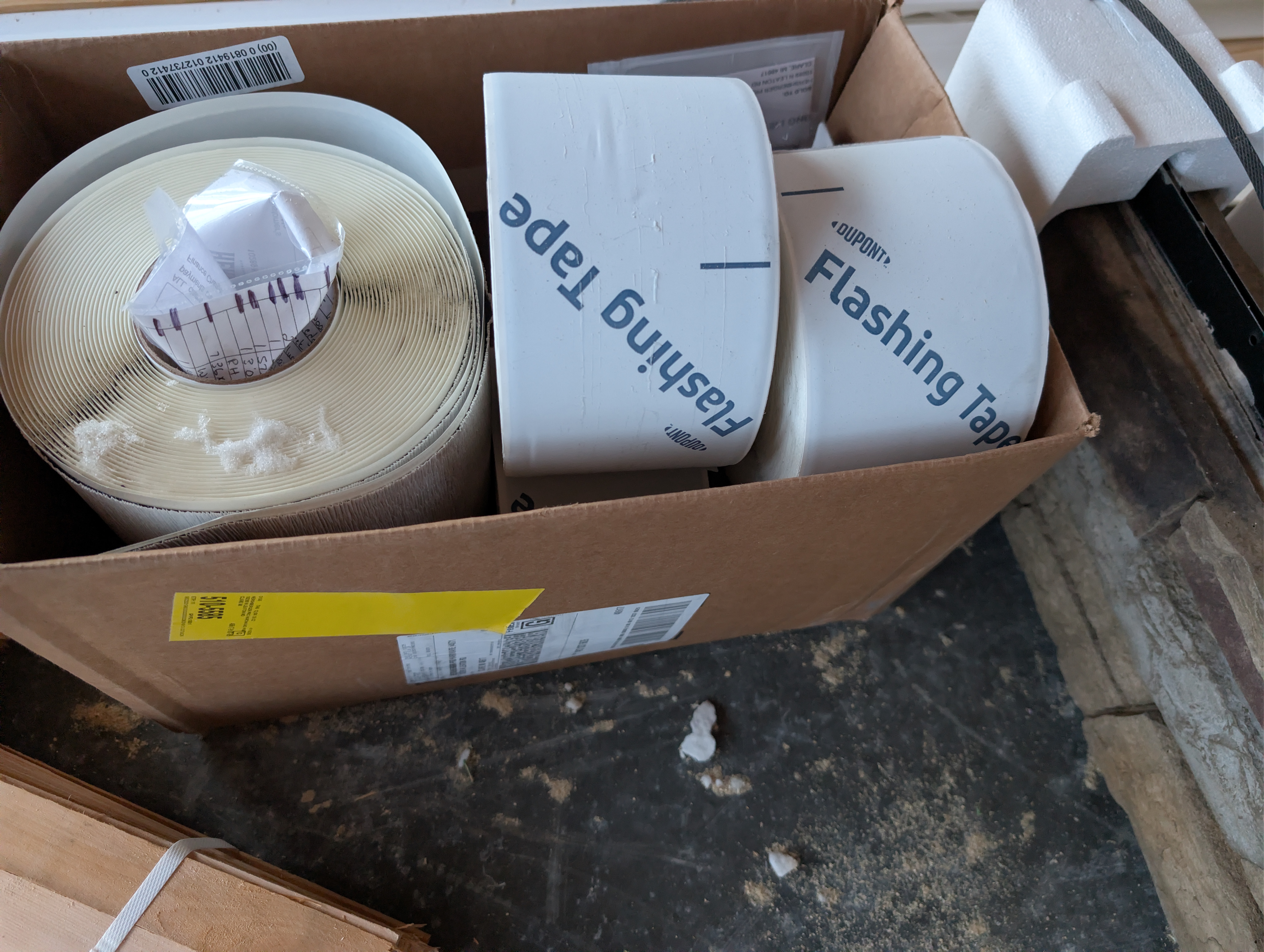 Box containing rolls of Dupont flashing tape