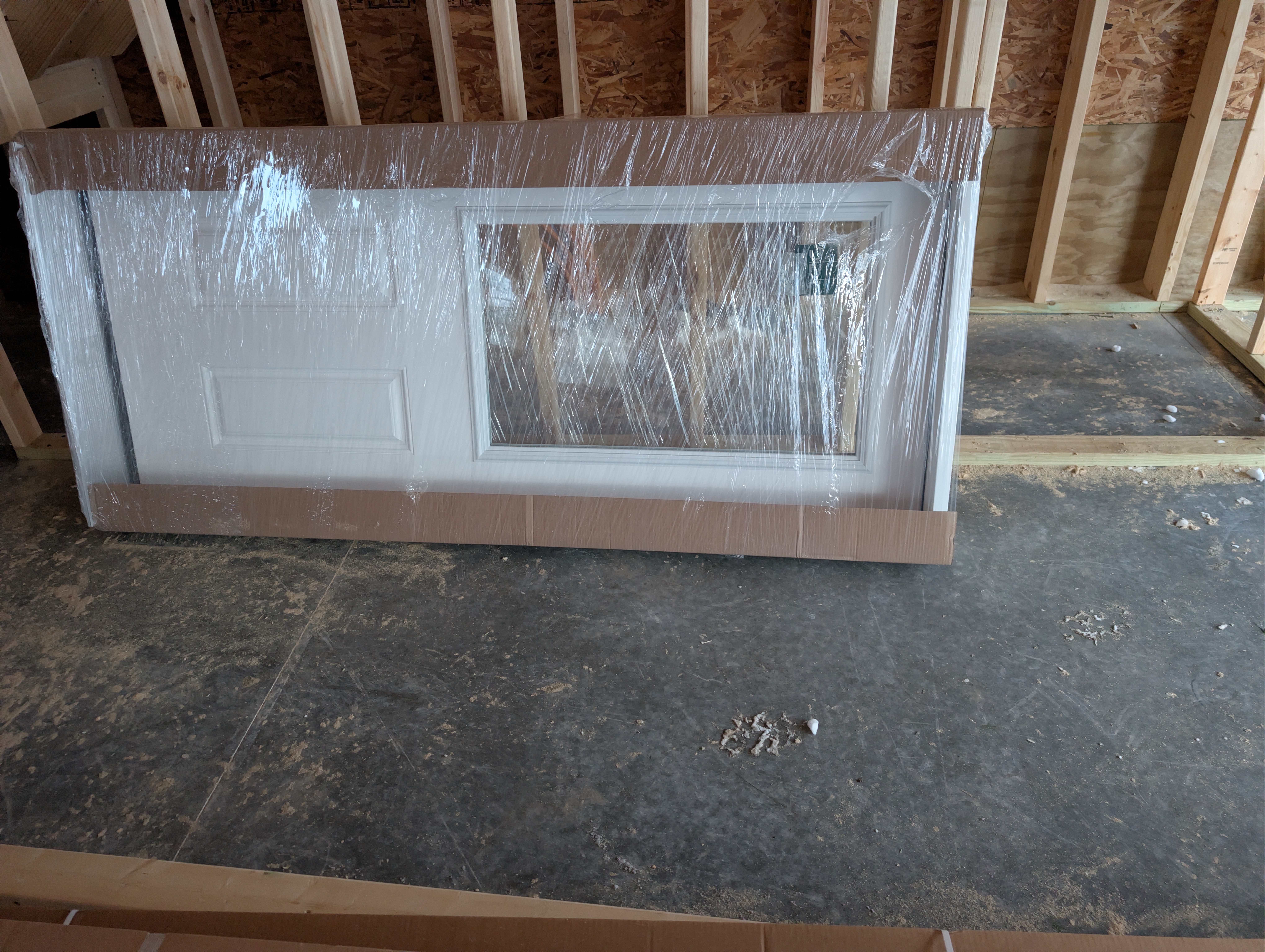 Half-lite exterior door in packaging