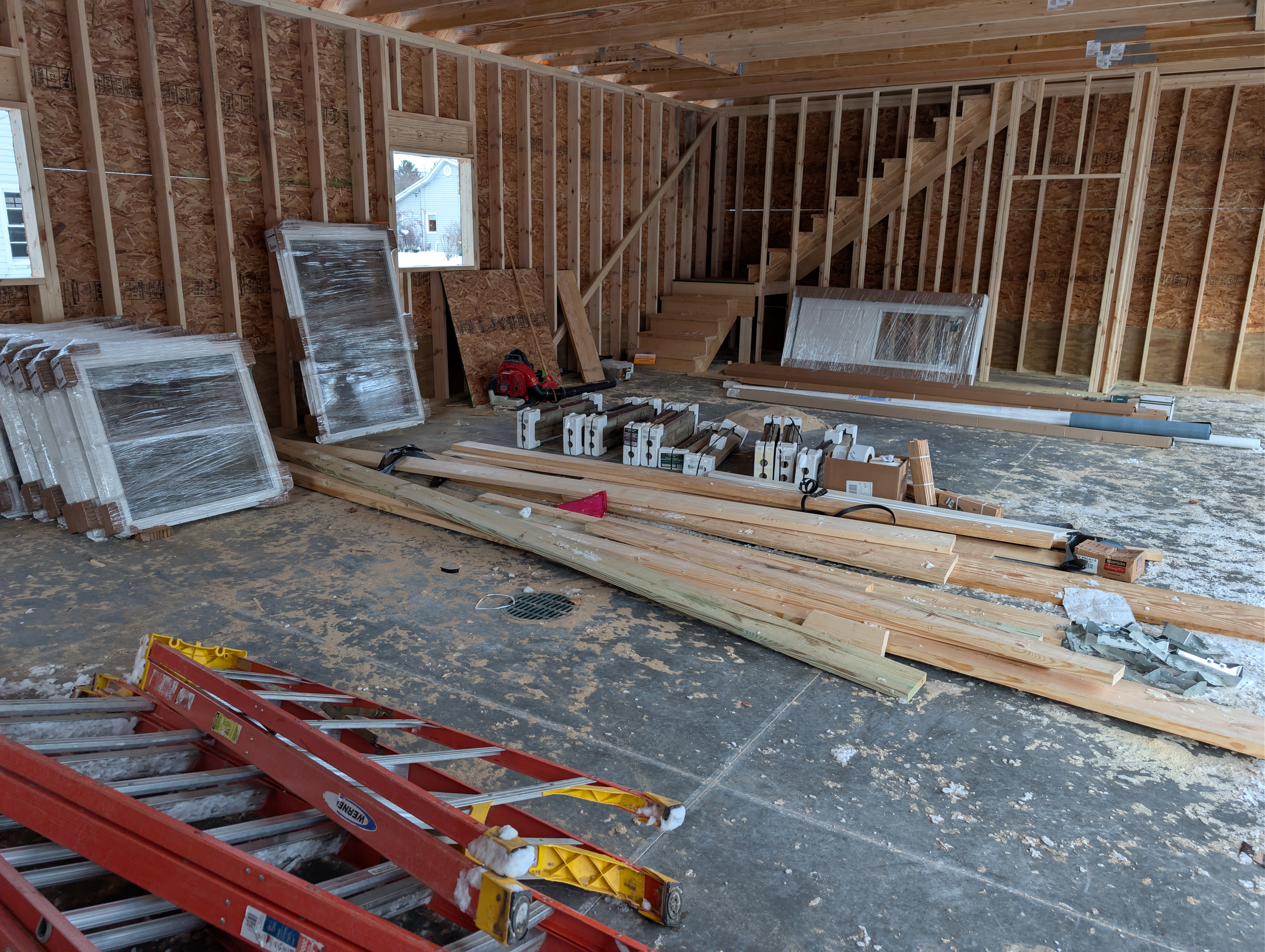 Interior view with stacked windows, stone panels, and trim
