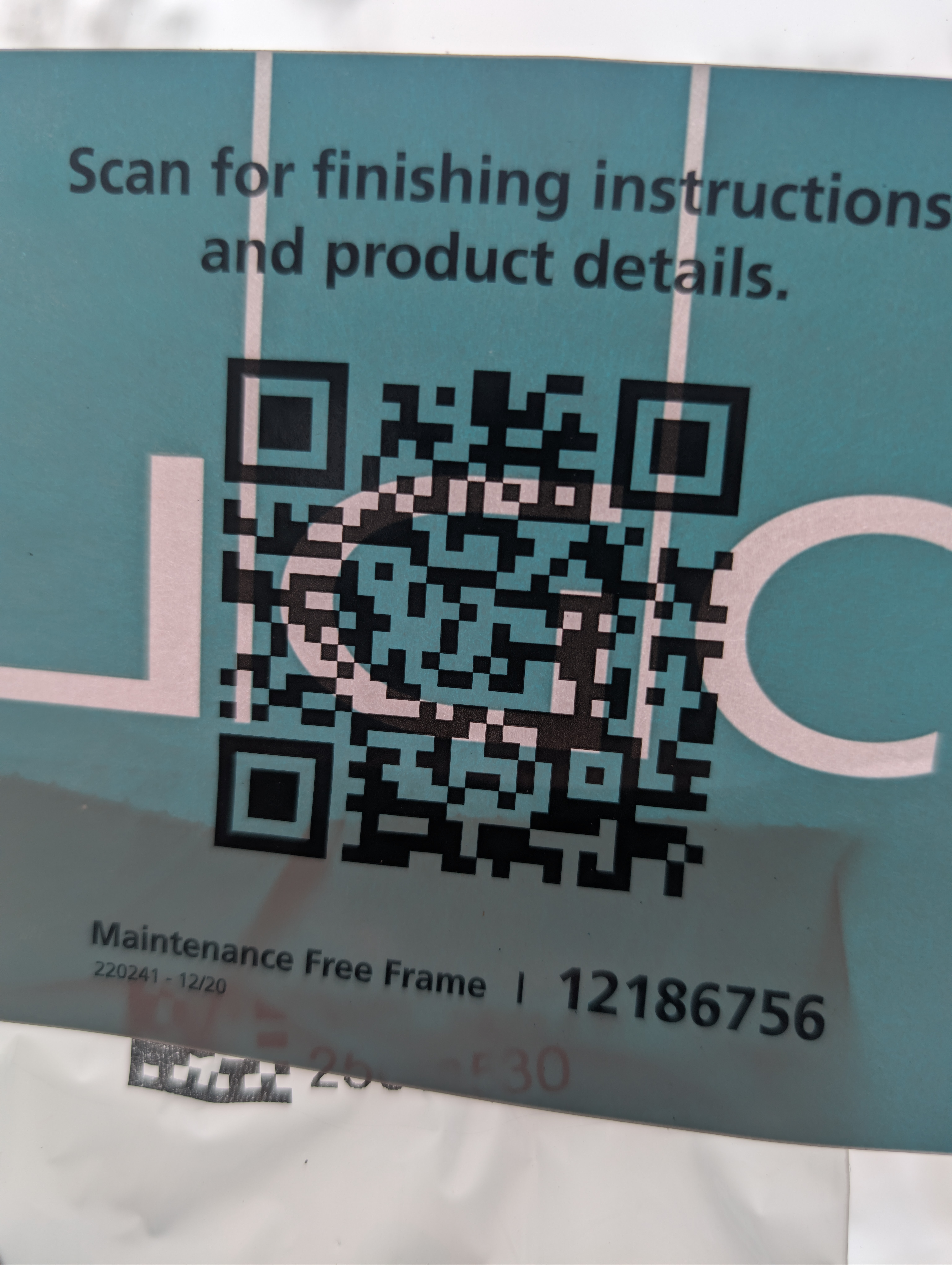 QR code sticker on window with finishing instructions text