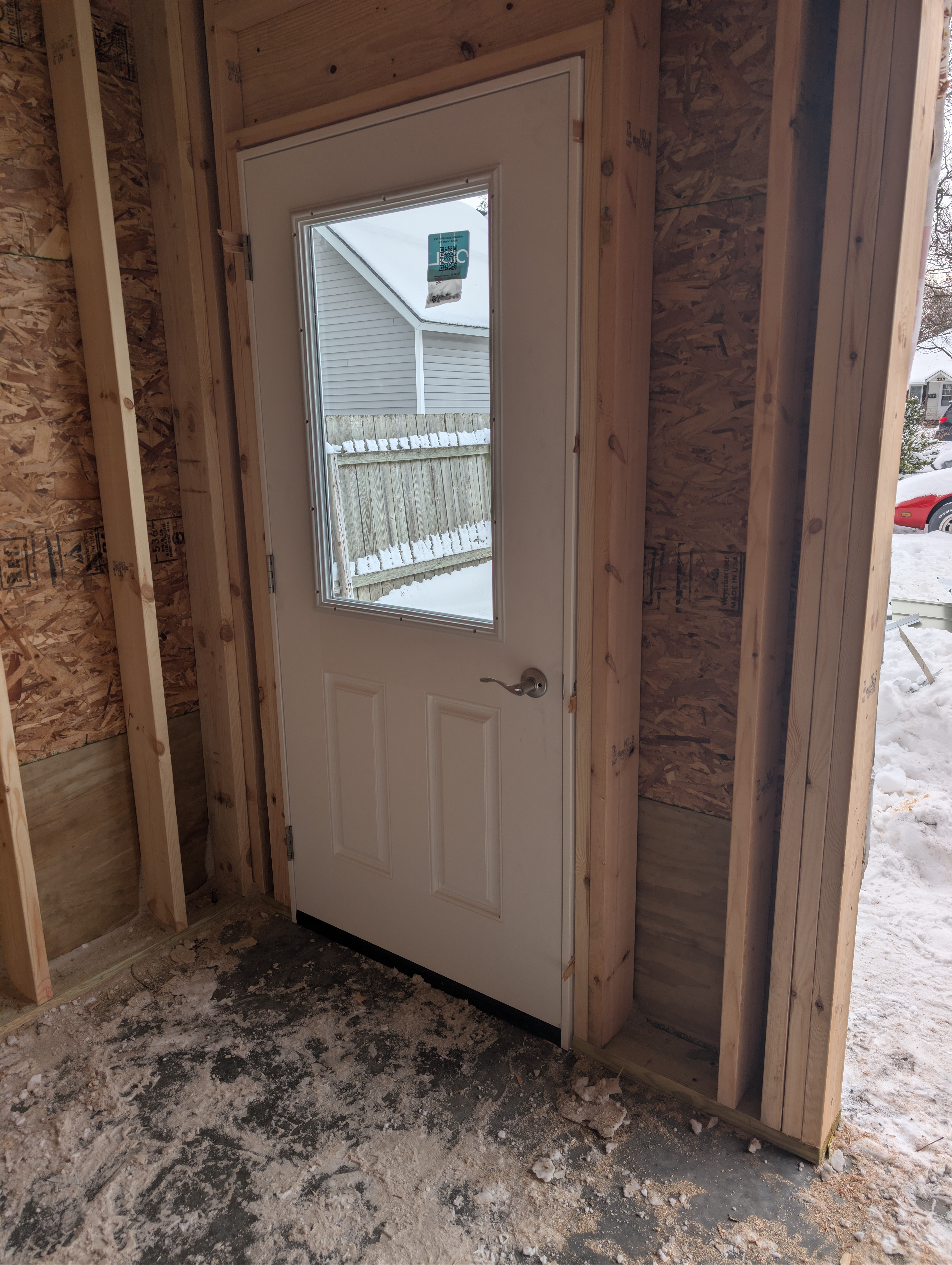 Interior view of installed main entry door with glass lite