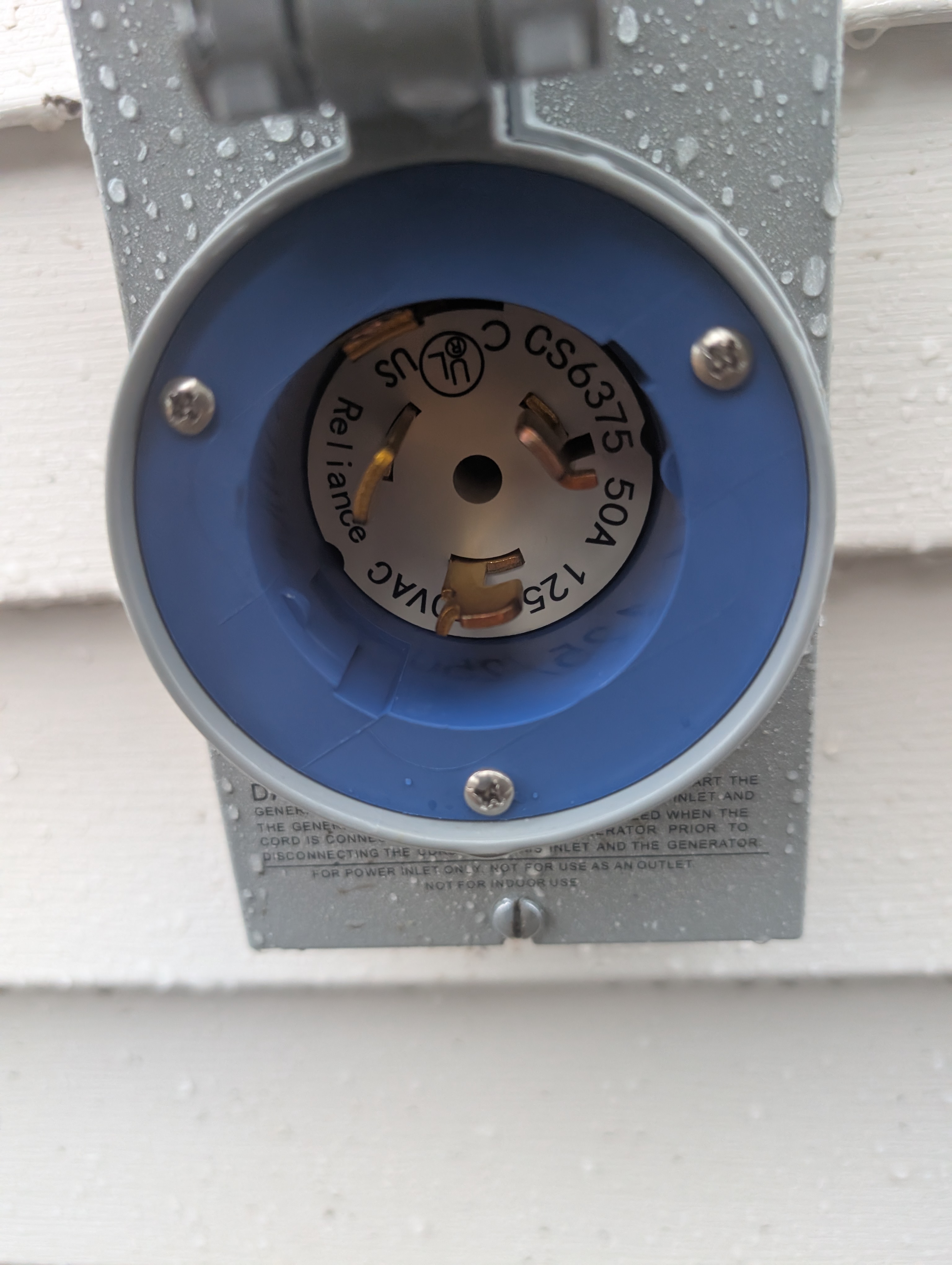 Reliance CS6375 50A generator inlet receptacle with lid open showing twist-lock configuration