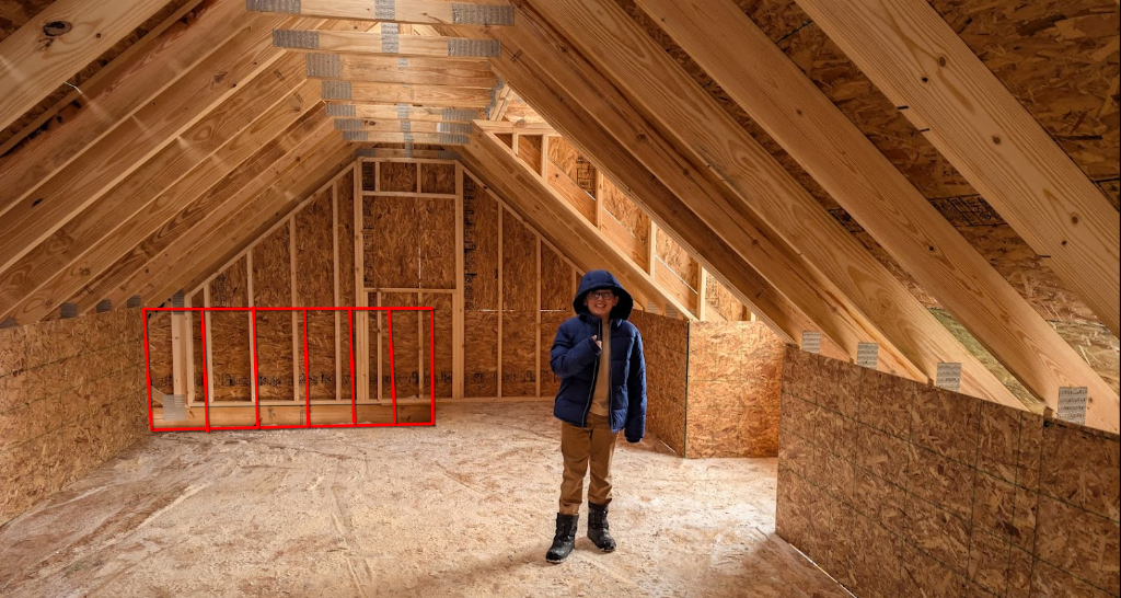 Loft interior with railing requirement marked in red